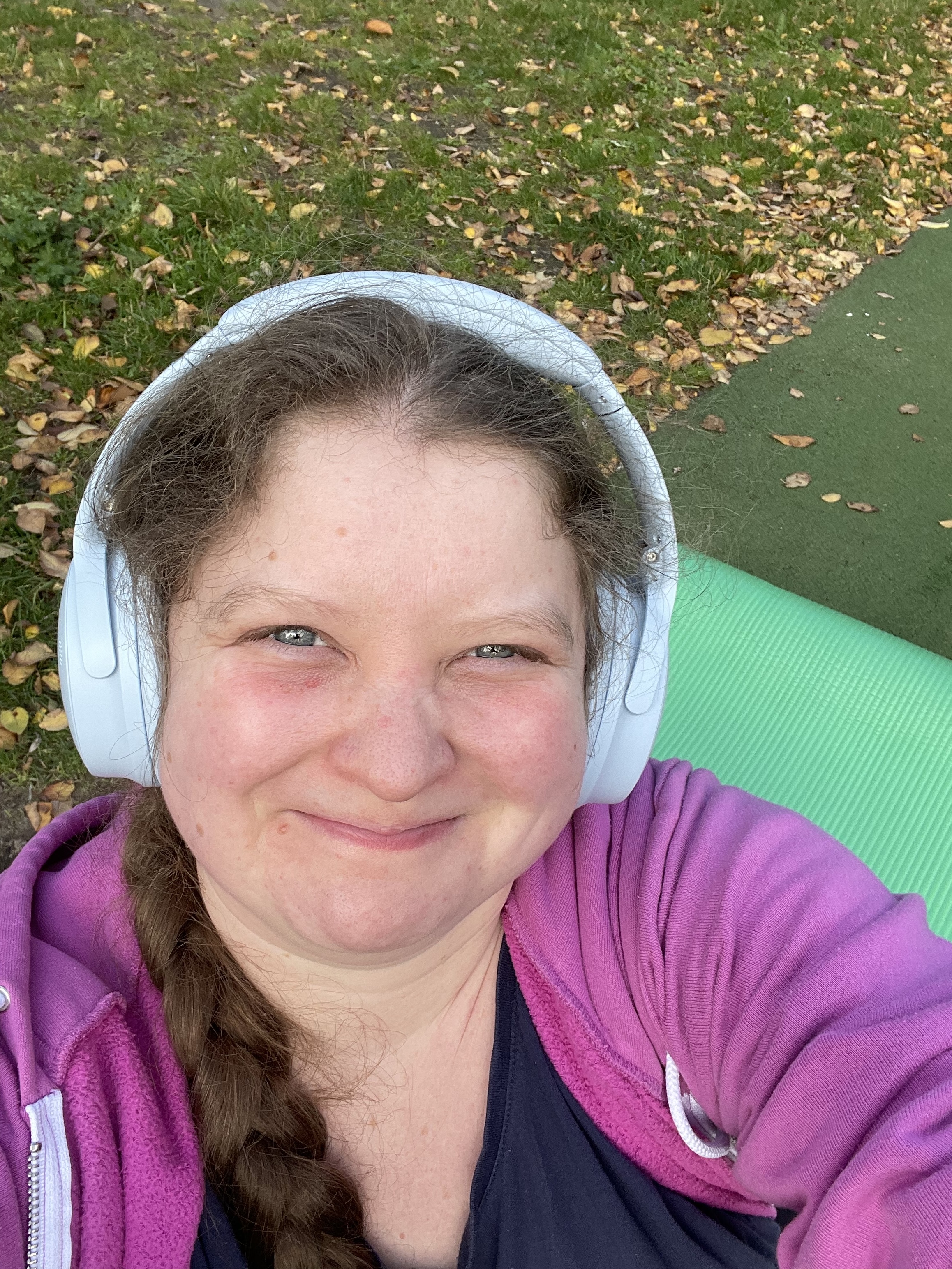 smiling woman in a pink hoodie